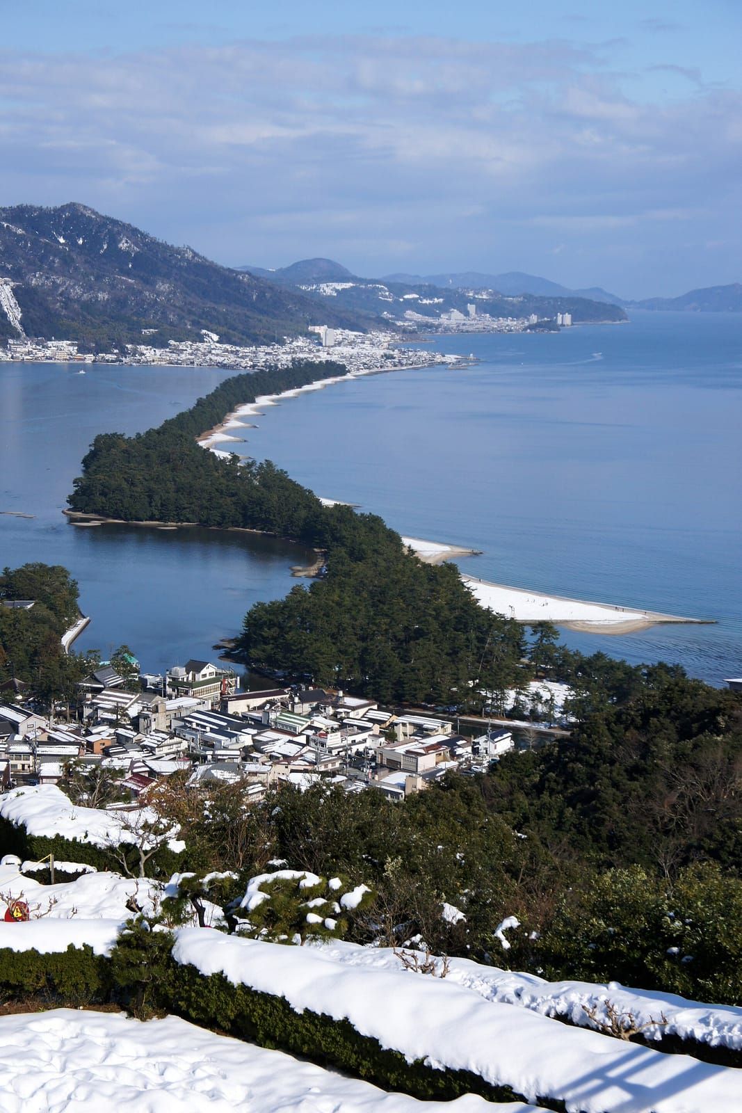 The Amanohashidate sandbar snaking across Miyazu Bay, seen from the View Land side on Mt. Monju